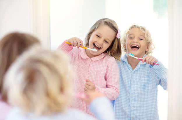 Children brushing teeth