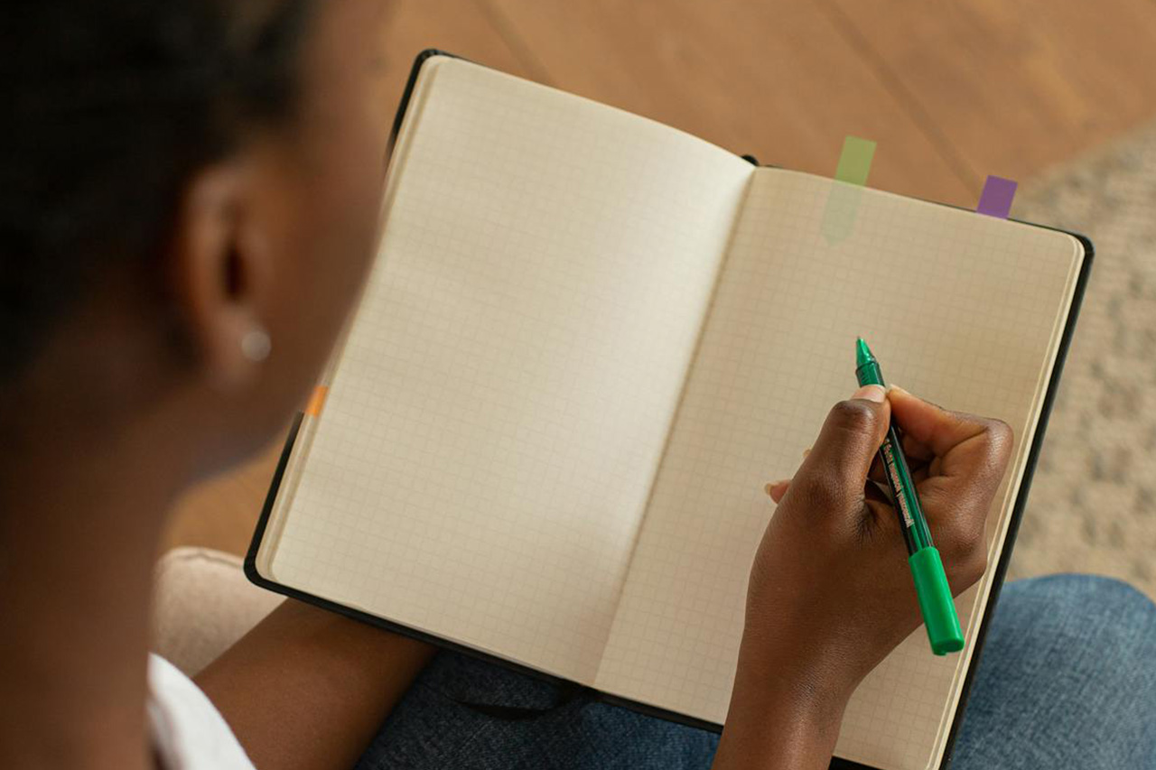 writing down notes for her dental appointment